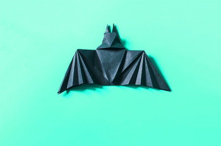 Handmade dark bat on a light backgroundの写真素材