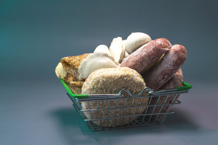 A basket with various semi-finished products in close-up. Fast food products.の写真素材