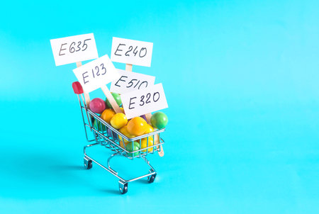 A grocery basket with various food additives in close-up on a light backgroundの写真素材