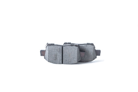 Two new brake pads for the car, taken in close-up on a light background, isolateの写真素材