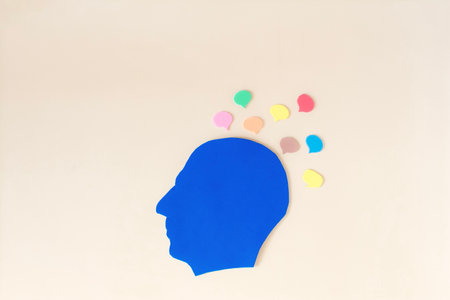 The silhouette of a human head and thoughts are messages in the form of colored messages around the head. A person receives information from different sourcesの写真素材