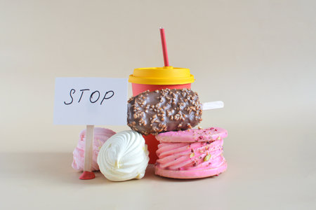 Warning about the danger of consuming large amounts of sweets and confectionery products containing simple carbohydrates in their compositionの写真素材
