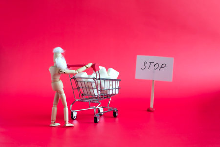 A man with a basket filled with sugar cubes, a close-up and a warning sign on a red backgroundの写真素材
