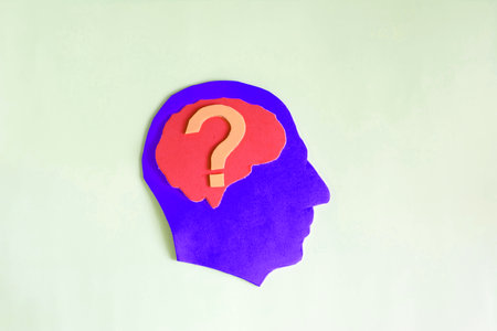 The silhouette of a human head with a question mark and a dedicated brain. A person thinks, plans,...