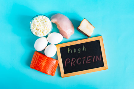 A set of products with a high protein content and the description "high protein" on a dark boardの写真素材