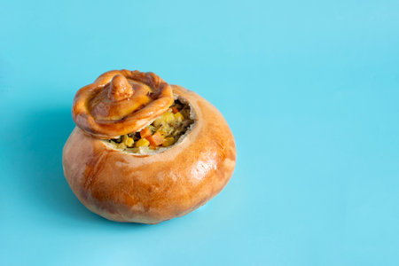 Roast with meat and vegetables in a dough pot close-up on a light backgroundの写真素材