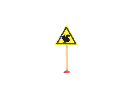 The warning sign is a silhouette of a squirrel in a yellow triangle. Playful squirrel sign in close-up in a yellow triangle on a white background, isolateの写真素材