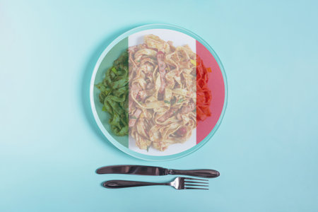 A light plate with pasta, inside of which the flag of Italy is depicted in close-up. The concept of Italian cuisineの写真素材