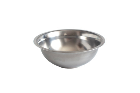 Empty metal bowl close-up on a white background, isolateの写真素材