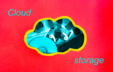 The concept of storing information in the cloud. A cloud carved in red thick paper with media inside...