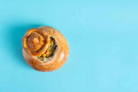 Roast with meat and vegetables in a dough pot close-up on a light background