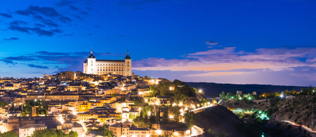 View of Toledo, Spain including Alcazar and the cathedral at dusk.の写真素材
