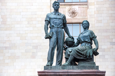 Statue of man and women in front of main building of Lomonosov Moscow State University, Russiaのeditorial素材