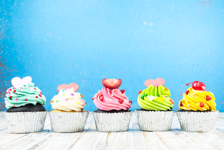 Colorful Cupcake on wood vintage backgroundの写真素材