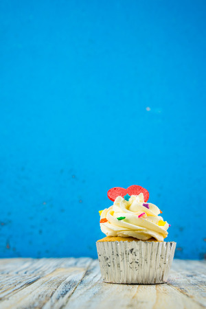 Colorful Cupcake on wood vintage backgroundの写真素材
