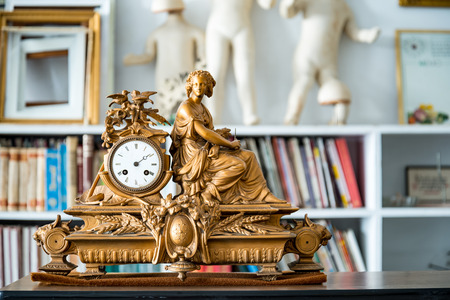 ancient vintage clock in blur vintage room interiorの写真素材