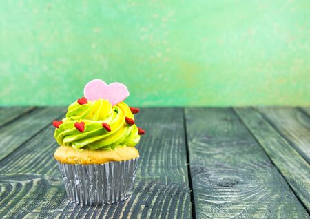 Colorful Cupcake on wood vintage backgroundの写真素材