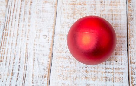 Christmas decorations and gift boxes on wooden board backgroundの写真素材