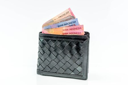 Indonesia Rupiah in leather wallet on white background