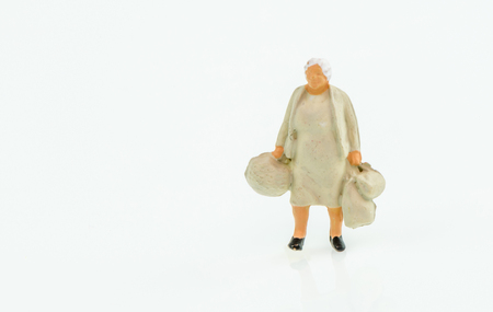 Miniature people business traveler concept on white background with a space for textの写真素材