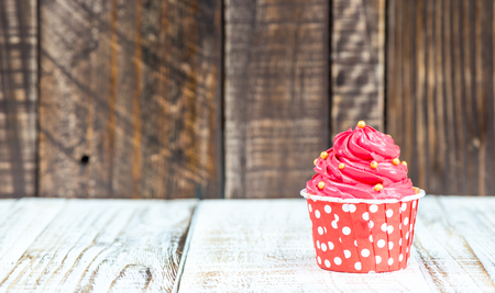 Colorful Cupcake on wood vintage backgroundの写真素材