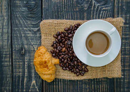 Different types of bread and bakery on a wooden backgroundの写真素材