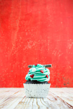 Colorful Cupcake on wood vintage backgroundの写真素材