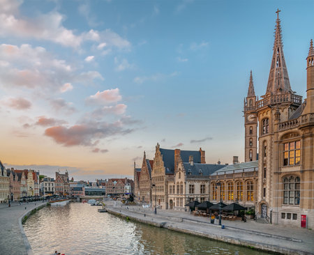 Medieval buildings overlooking the "Graslei harbor" on Leie river in evening twilight, Ghent, Belgiumの写真素材