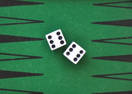 two dice on a green gaming tableの写真素材