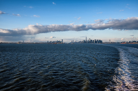 New York City skyline with urban skyscrapers over Hudson River at sunset. Manhattan downtown...
