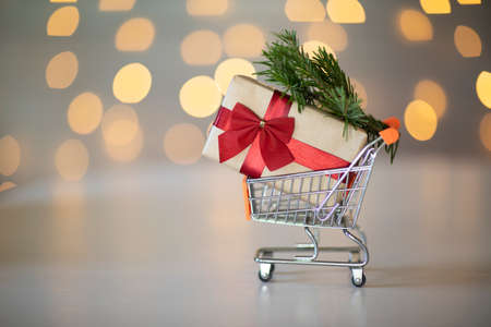 Christmas gift in a supermarket mini trolley