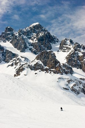 Skier goes down the slope at French Alps