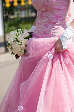 Bride with wedding bouquet at sunny day croppedの写真素材