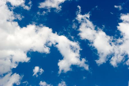 Summer sky with some clouds backgroundの写真素材