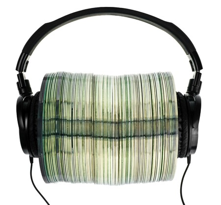 HI-Fi headphones on stack of CDs on white backgroundの写真素材