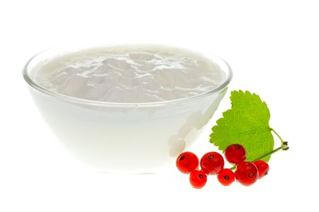 Yogurt bowl with Redcurrant berries on white backgroundの写真素材