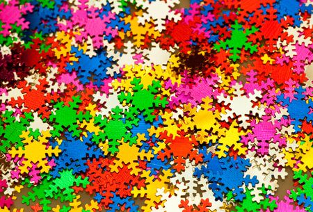 Multicolored snowflake shaped confetti backgroudの写真素材