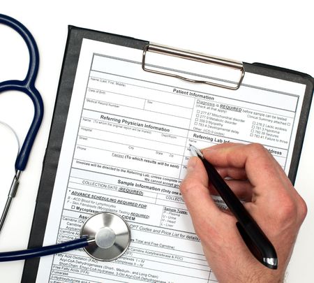 Hand with pen over blank Patient information and stethoscope on white background