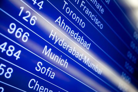 Blue flight information board in airport, selective focusのeditorial素材