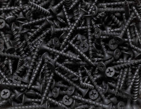 Box with black screws close-upの写真素材