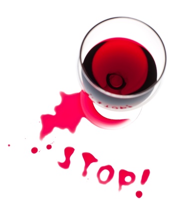 The word Stop written with poured red wineの写真素材