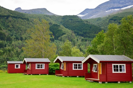 Red wooden cabins at campsite in Norwayの写真素材