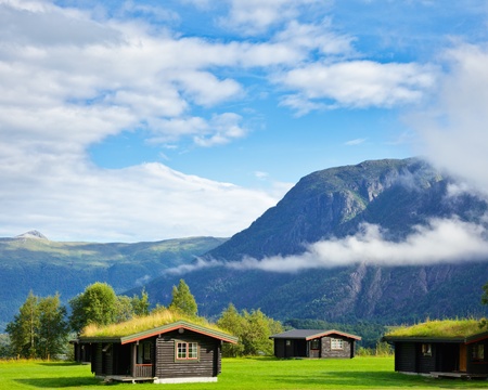 Wooden cabins with turf roof at a campsite in Norwayの写真素材