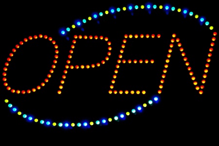 Glowing LED Open  sign on a black background