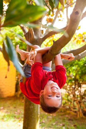 Happy boy enjoying  summer day in a gardenの写真素材