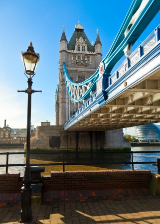 London cityscape with street lamp and Tower Bridge over the River Thames in backgroundの写真素材