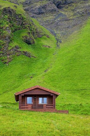 Wooden cottage at a mountain in Iceland