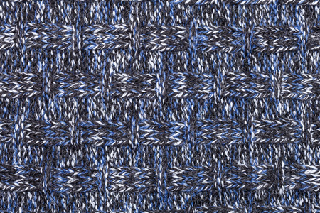 Blue white black knitted fabric made of heathered yarn textured background