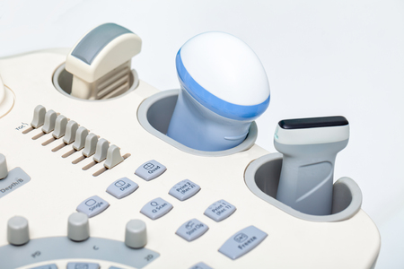 Close-up shot of medical ultrasound scanner with ultrasonic transducer, control bittons knobs and slidersの写真素材
