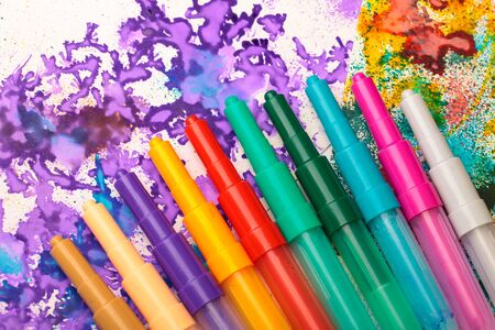 Color marker pens with child's drawing on a table art creativity backgroundの写真素材
